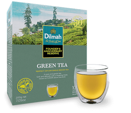 Green Tea of Dilmah Pack and a Glass of Tea